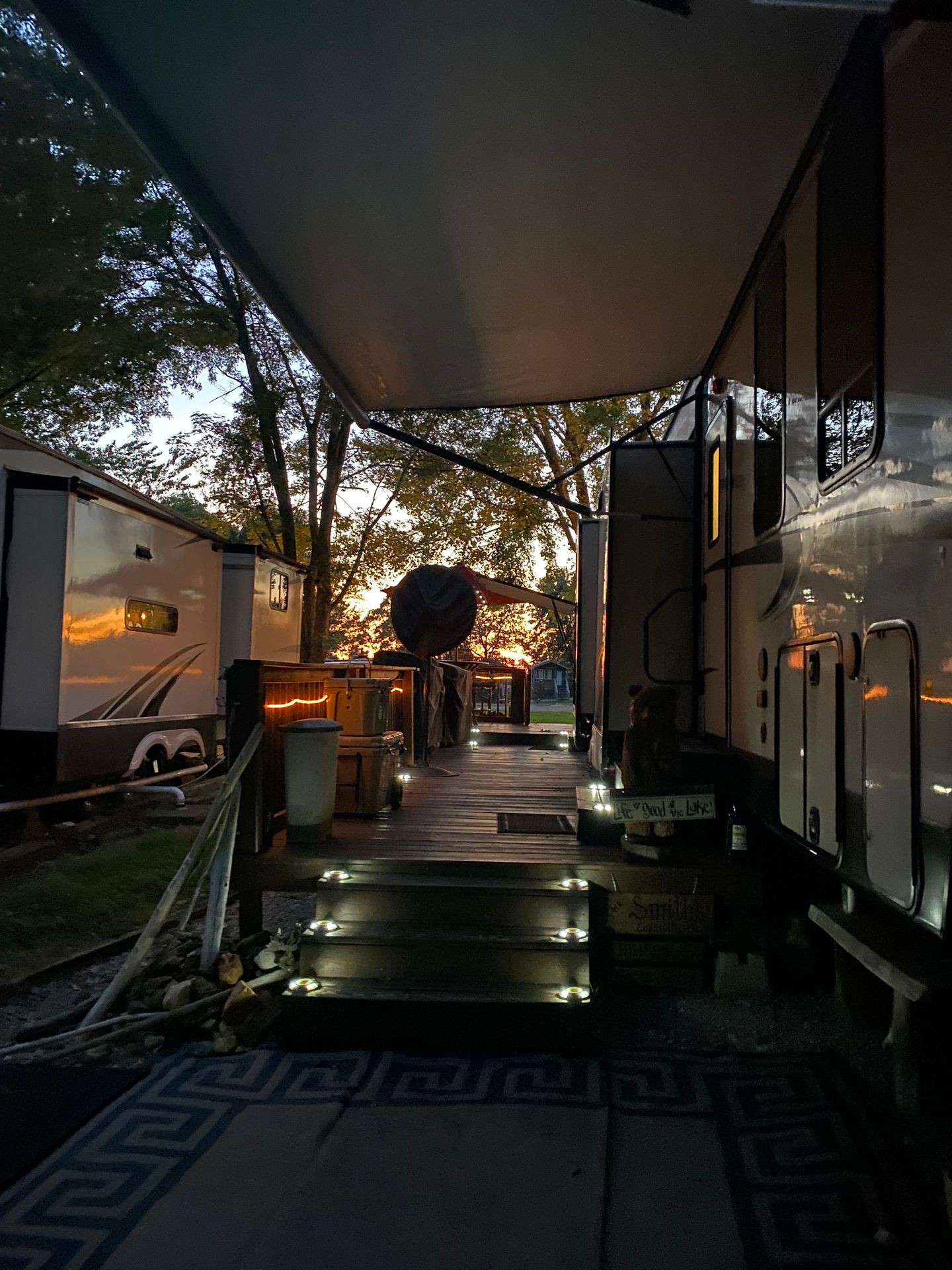 camper at sunset with deck